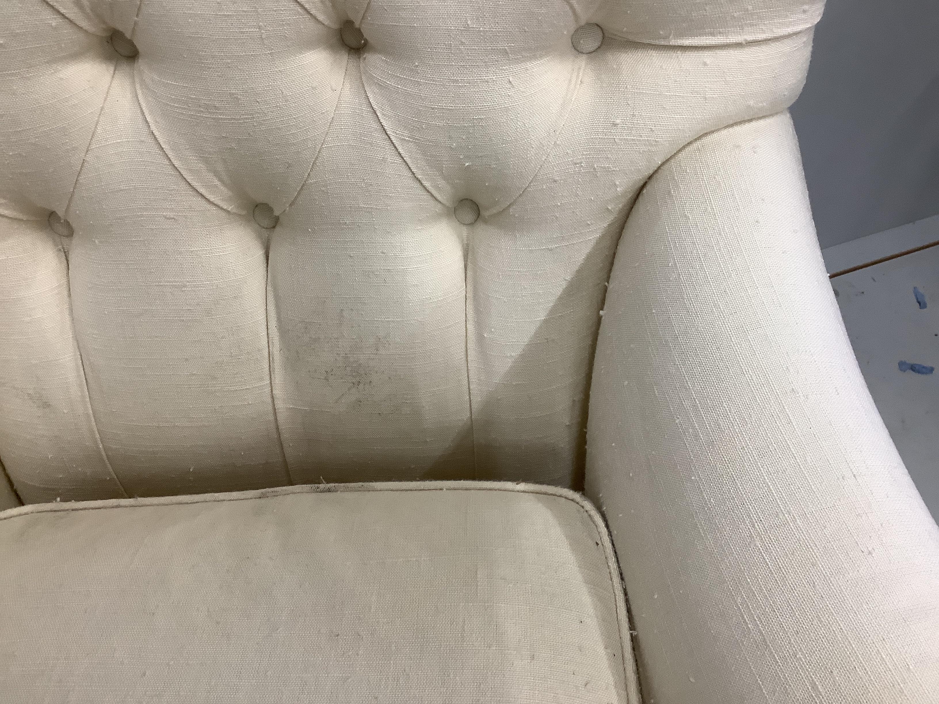 A pair of Victorian style upholstered buttonback armchairs, width 80cm, depth 70cm, height 85cm